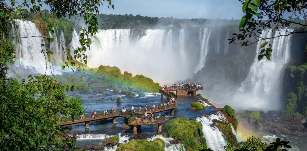 Tourists Exploring Iguazu Falls on the Border of Brazil and Argentina
